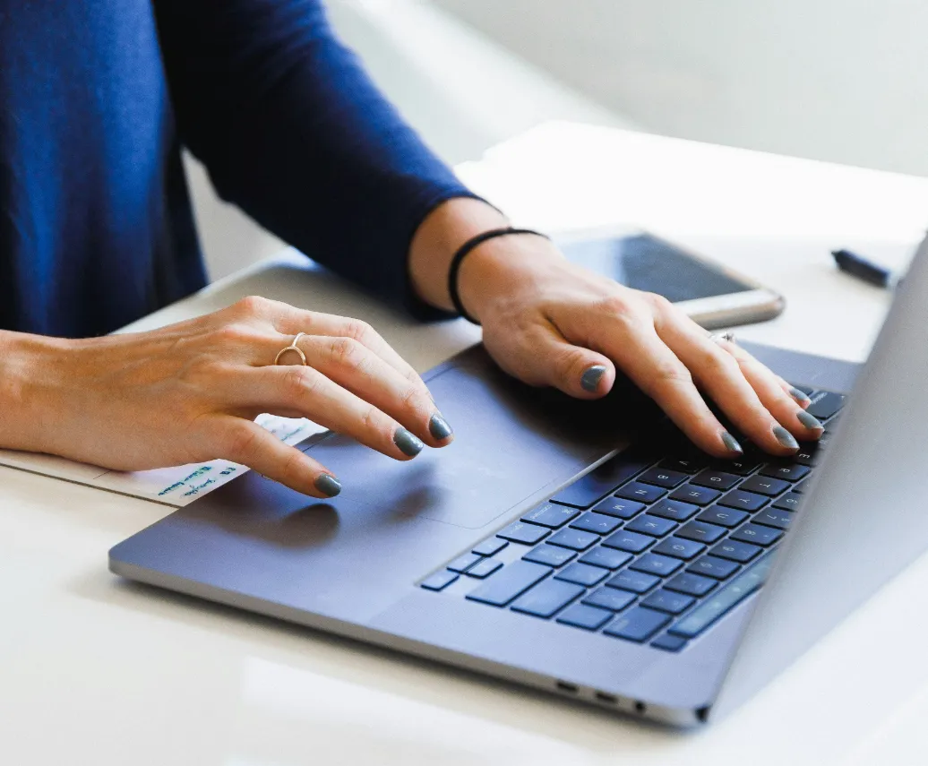 Hands on a laptop